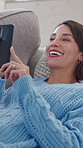Relax, phone and woman on couch laughing for funny joke, meme and social media post on living room in home. Chat, texting and mature happy person on mobile app for online comedy and humor on sofa