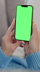 Woman, hands and phone with green screen in home for reading fake news, social media browsing and online app. Person, smartphone and chroma key display with mockup space and streaming service on sofa