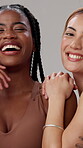 Women, smile and face with skincare in studio for natural beauty, dermatology and facial glow. Friends, relax and happy with confidence by gray background for cosmetics, treatment or pride with shine