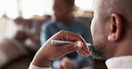 Listening, therapist and man with pen, patient and counseling for mental health advice on office sofa. Help, support or person on couch with psychologist for consultation, trauma or stress management