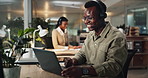 African man, call center and laptop for talking, typing and advice with telemarketing at night. Person, consultant and headset with mic, smile or customer service on voip for tech support at startup