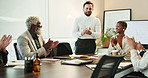 Meeting, documents and business people in office, applause or celebration with positive feedback. Employees, group or coworkers in boardroom, clapping or achievement with kpi target, success or goals