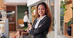 Hotel, receptionist and face of woman with arms crossed for hospitality service, pride or confidence. Happy, person and worker with smile at front desk for check in, accommodation or career in Brazil