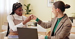Business, people and laptop with fist bump for celebration in office with marketing campaign success and positive review. Professional, women and teamwork with handshake at desk for corporate deal