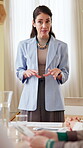 Office, businesswoman and presentation with discussion for training, sales strategy and teaching. Workplace, female speaker and employees with information for corporate project, feedback and workshop