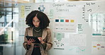 Business woman, whiteboard and strategy with tablet for company growth or planning at office. Young, female person or employee with technology or daily report for data, review or corporate statistics
