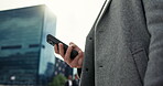 Person, hand and mobile in city for business, connectivity and communication for networking. Man, phone and closeup in urban New York for email, map app and online taxi service for travel or commute