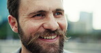 Outdoor, businessman and happiness at city as property developer with pride, plans and vision. Closeup, male person and employee with smile for urban development, infrastructure and career growth