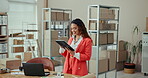 Boxes, typing and woman with tablet, office and communication for order, ecommerce and entrepreneur. Logistics, person and checking of delivery on app, small business and distribution of stock