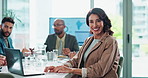 Boardroom, laptop and smile of business woman in office with colleague group for meeting or planning. Computer, portrait and typing with happy employee in professional workplace for administration