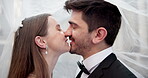 Happy couple, veil and kiss for wedding, marriage and love together with smile, joy and commitment in city. Bride, groom and ceremony outdoor for relationship, romance or celebration with connection 