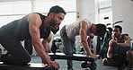 Men, coach and dumbbell with motivation at gym with workout, goal or high five for muscle growth. Personal trainer, people and together with bodybuilder for training, exercise or tablet for wellness