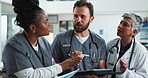 Tablet, team and doctor with nurses for discussion, planning and help interns in hospital. Technology, medical group and talking to mature surgeon for training, meeting and healthcare for wellness