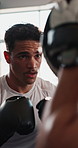 Man, personal trainer and boxing workout in gym with punch training, fight preparation and self defense practice. Athlete, boxer fitness or intense power exercise at sports center for match endurance