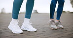 Legs, workout and outdoor as challenge, fitness and teamwork for strength training in city. Female people, stretching and feet for strong muscle, exercise and sport in physical activity, gym or class