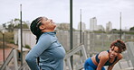 Tired, running and team with women in city for fitness challenge, training and wellness. Fatigue, health and workout with people in urban outdoor for exercise, marathon runner and sports athlete
