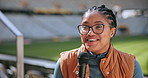 Journalist, mic and talking in stadium for interview, press conference and sports with broadcast. Woman, speaking and media relations presentation in arena for fitness event, television and news