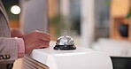 Front desk, finger and bell ring for check in, welcome and help with service alert. Waiting, business person and concierge signal for customer, hospitality or holiday with hotel, lodge and vacation
