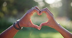 Hands, couple and heart gesture for love outdoor of healthy relationship, commitment and marriage opinion. People, symbol and bonding together with loyalty, care and partner respect for romance trust