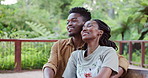 Relax, bench and black couple in nature for calm morning on honeymoon vacation together. Love, bonding and African people with connection, care and marriage unity outdoor in park for plants in garden