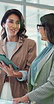 Office, businesswomen and discussion with tablet for social media, post update and check company review. Team, manager and seo specialist with digital for search ranking, online trends and feedback
