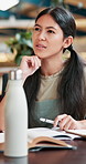 Student, thinking and books with woman in cafeteria for studying, writing idea and college thesis. University, learning and education with person on school campus for knowledge, future and youth.
