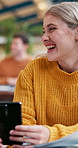 Woman, smartphone and laugh with funny joke, meme and conversation for group project in office. Creative person, social media and discussion for news, notification and talking in coworking space