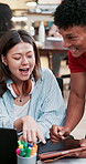 Creative people, laptop and tablet with funny joke, laugh and planning for group project in office. Woman, man and internet meme for happy, smile and talking in coworking space with conversation