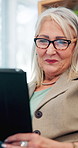 Elderly woman, tablet and smile on video call for communication, connection and conversation in home. Senior female person, retirement and technology for chat, happiness and streaming on social media