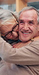 House, hug and senior couple with love, bonding together and happiness with relationship. Apartment, embrace and old man with elderly woman, joy or retirement with smile, marriage and care with trust