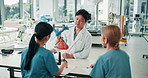 Doctor, medical students and teaching cardiology with model, heart or advice for learning with info at hospital career. Japanese people, point and education for group, show or listen for college test