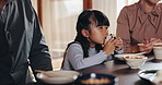 Japanese family, table and child at dinner with food, happiness and bonding together for healthy meal. People, girl and hungry for eating, diet and nutrition in dining room or home for supper or care