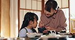 Japanese mother, care and child at lunch for food, happiness or bonding together for healthy meal. Woman, girl and hungry for eating noodles, diet and nutrition in dining room at table in family home