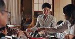 Japanese family, house and child at dinner for food, happiness and bonding together for healthy meal. People, kid and hungry for eating dumplings, diet and nutrition in dining room at table with love