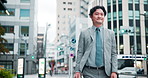 Business, man and walking outdoor in city for morning commute, journey to work and corporate travel. Professional, pedestrian and person with smile in urban street for trip to destination in Japan