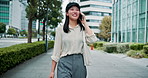 Japanese, phone call and woman in city, walking and communication with connection. Asian person, outdoor and girl with smartphone, network and digital app for chatting, smile and urban town with joy