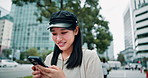 Japanese, woman and smile with mobile in city, scroll and browsing on application for direction. Urban, female person and happy with smartphone for online map, typing location and travel in Tokyo