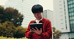 Japanese, typing and man with tablet, outdoor and internet with social media, network or digital app. Asian person, smile and guy with tech, urban town or message to contact, connection or buildings