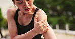 Fitness, shoulder and woman with pain, injury and broken with accident, muscle tension and Japanese. Person, runner and athlete with bruise, strain and burnout with inflammation, joint ache or sports