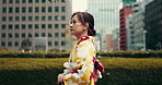 Japanese woman, walking and city with traditional clothes, outfit and fashion as model or creative. Female person, heritage and kimono for style, culture and dress for tourism, travel and adventure