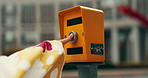 Hand, traffic and crossing for pedestrian in city for travel, journey and adventure for sightseeing. Female person, pressing button and walking for tourism, culture and historical landmark in Japan