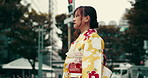 Japan, city and woman with thinking in street for reflection, contemplating and insight in kimono. Person, travel and thoughtful in traditional fashion outdoor with daydreaming of heritage or culture