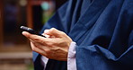 Japan, hands and person with phone in city with social media, texting and internet scroll outdoor. Kimono, fashion and Japanese culture with mobile networking, contact and traditional montsuki on web