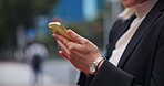 City, person and hands with smartphone for communication, chat or schedule appointment for meeting. Outdoor, corporate lawyer or connection with mobile for networking, notification or travel in Japan