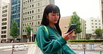 Direction, phone and walking with woman in city, outdoor for communication, sightseeing or travel. App, map and search for location with Japanese tourist person in urban town to explore destination 