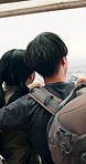 Backpacking, view and couple on vacation, pointing and tourists in nature, hug and romance for date. Outdoor, embrace and sightseeing of location, travel and people on holiday, bonding and Japan