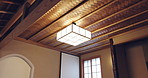 Interior, hotel and Japanese design of light with decor, lantern and vintage lamp fixture. Wood, hanging and below with resort restaurant in Japan with minimalist architecture and cube chandelier