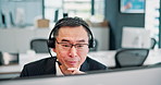 Man, talking and headset with computer at call centre of customer service, account advice and feedback. Mature agent, mic and telemarketing for technical support, faq guide and crm solution in Japan 
