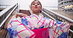 Japanese woman, kimono and dancing in city for culture, traditional performance and freedom with energy. Asian girl, moving and dancer with art, heritage and creative with portrait on steps outdoor