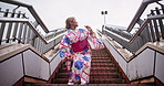 Dance, steps and tradition with woman in city for art, creative or expression of Japanese heritage. Culture, kimono and movement with Asian person in urban town for choreography, energy or rhythm
